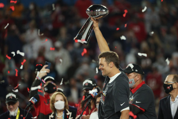 Tampa Bay quarterback Tom Brady celebrates with the Lombardi Trophy after his team won 31-9 over the Kansas City Chiefs