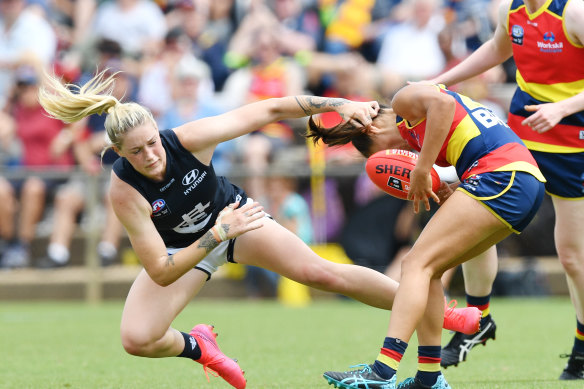 Harris tackles Justine Mules of the Adelaide Crows during the Round 4 AFLW match at Richmond Oval in Adelaide, March 1, 2020. 