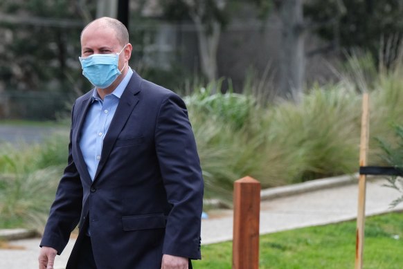 Treasurer Josh Frydenberg masks up in Melbourne on Saturday.
