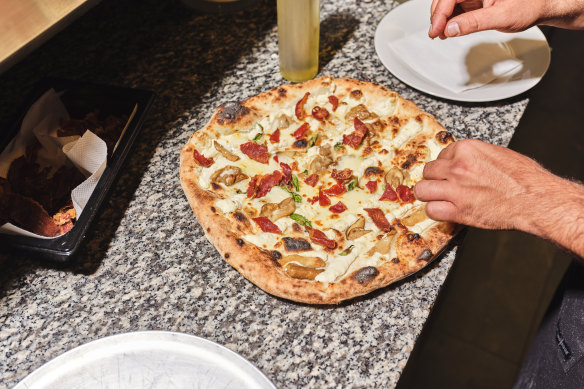 Naples-style pizza is a specialty.