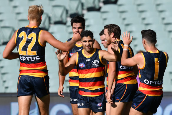 Crows forward Tyson Stengle, centre, celebrates a goal during round one, before the season was suspended due to coronavirus. 
