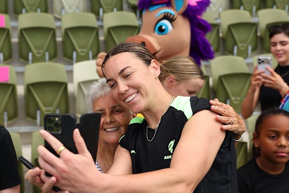 Mackenzie Arnold poses for a selfie with a Matildas fan after training in Perth on Wednesday.