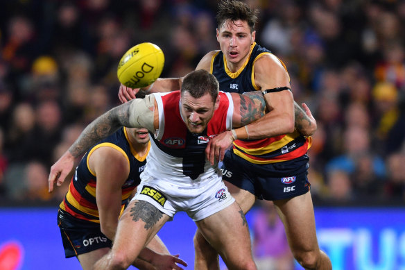 Tim Membrey of the Saints and Jake Kelly of the Crows battle for the ball.