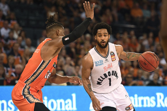 Tough night: Melo Trimble of Melbourne United looks to get past Scott Machado of the Taipans during the round-four clash.