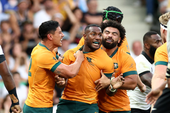 Suli Vunivalu celebrates his try that gave the Wallabies some hope.