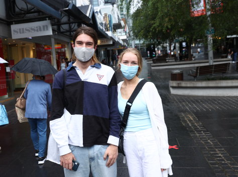 Luca Aroney and Lauren Chadlowe shopping for masks in Chatswood.