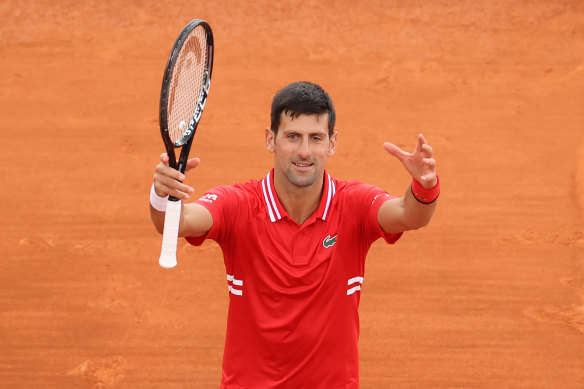 Back in action: Novak Djokovic celebrates his win.