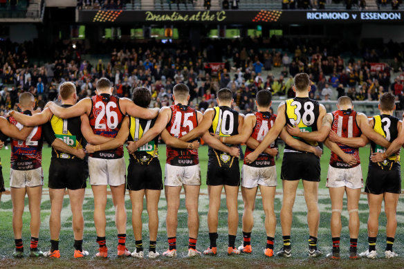 Richmond and Essendon players line up together at Dreamtime at the 'G last year.