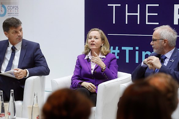 Emissions Reduction Minister Angus Taylor, left, at the Madrid COP 25 with acting Spanish Economy Minister Nadia Calvino and Werner Hoyer, president of the European Investment Bank.
