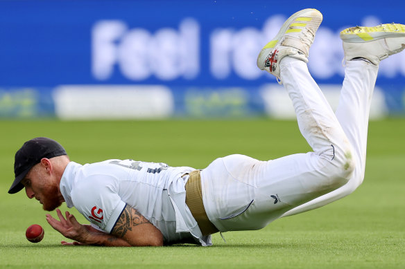 Missed chance: Ben Stokes drops an attempt to catch Nathan Lyon.