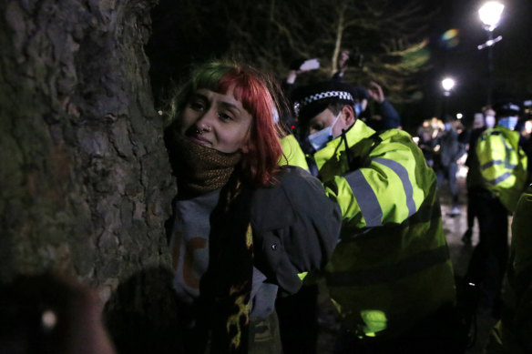 A woman is arrested during a vigil for Sarah Everard at Clapham Common this month. The UK police watchdog says officers didn’t behave “in a heavy-handed manner”.