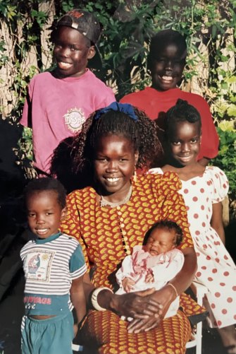 Atong Atem (in spotted dress) with her mother Anna and siblings, clockwise from top left, Dut, Deng, baby Nancy and Akim.