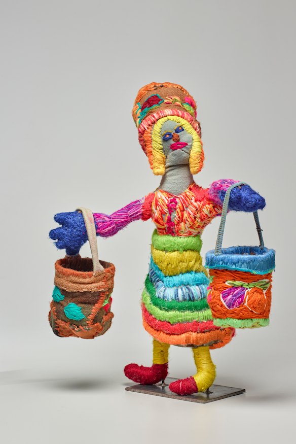 Marlene Rubuntja’s ‘Woman with Dilly Bags and Dilly Bag hat’ 2019.