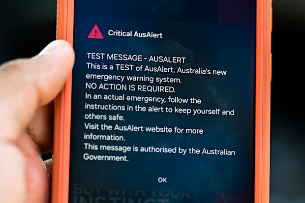 In this photo illustration, a critical AusAlert - Test Message notification appears on a smartphone July 27, 2026 in Sydney, Australia