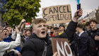 Fans of Chelsea Football Club protest against the European Super League outside Stamford Bridge.