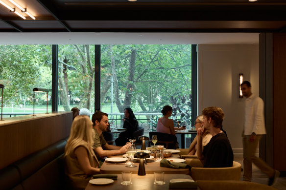 The hotel restaurant looks out over Hyde Park, “a giant lozenge of Victoriana greenery”.