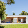 The living and dining quarters open to a generous garden.