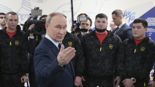 Russian President Vladimir Putin meets with servicemen wounded in Russia’s war on Ukraine during a visit to the Priorov National Medical Research Centre of Traumatology in Moscow.