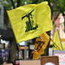 A Hezbollah flag at a pro-Palestine rally outside the State Library of Victoria on Sunday.