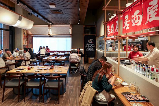 The space seats 150, with a bar for solo diners and booths for groups.
