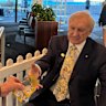 Bookmaker Robbie Waterhouse hands over the election bet cash to former Labor minister John Brown.