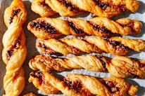Cheese straws twisted with chilli crisp.