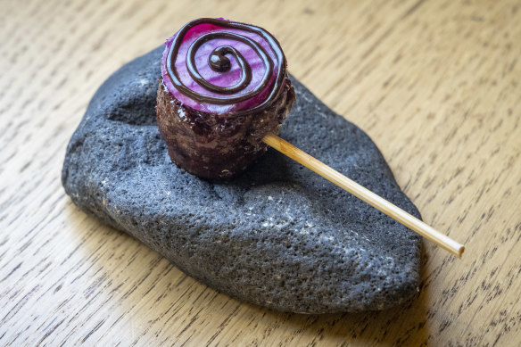 Wagyu “lollipop” with beetroot glaze.