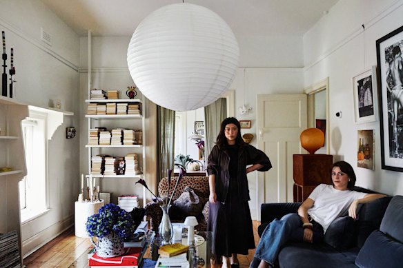 Nicole Williams (left) and Reinette Roux in their lounge room. The glass and lucite coffee table was purchased from a friend.