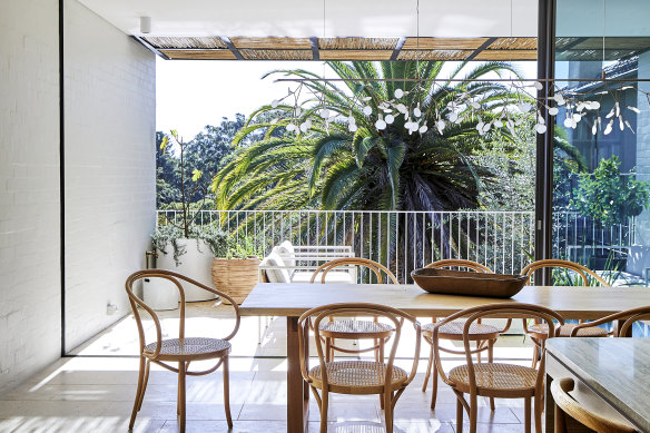 At the rear of the house, the open-plan entertaining zone flows from the airy dining area to a spacious outdoor terrace.