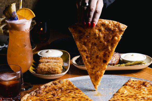 Pizza Pizza Pizza does slices late into the night. 