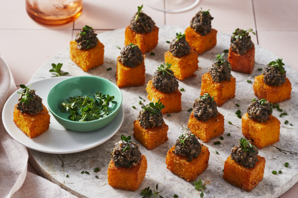 Polenta cubes topped with mushroom duxelle.