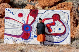 Betty Kuntiwa Pumani with her major work Antara commissioned for Malatja-malatja at Bundanon, 2025.