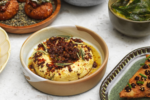 Whipped smoked hummus with pine nuts, lamb and crispy rosemary.