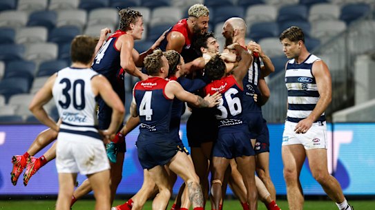 GEELONG, AUSTRALIA - AUGUST 21: The Demons celebrate a goal to Max Gawn of the Demons after the siren to win the round 23 AFL match between Geelong Cats and Melbourne Demons at GMHBA Stadium on August 21, 2021 in Geelong, Australia. (Photo by Daniel Pockett/Getty Images)