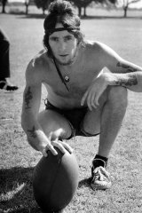 Bon Scott with a football at Centennial Park in 1970, before he was frontman for AC/DC.