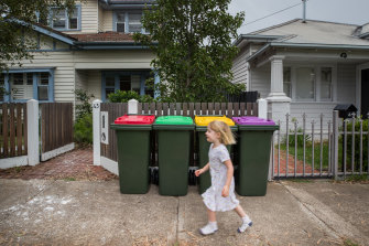 Three-year-old Abby runs past bins in Spotswood, Melbourne. Australian environment Minister Sussan Ley wants bin “harmonisation” to ensure all guidelines are the same. 