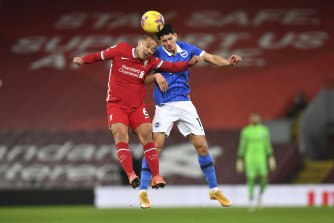 Liverpool’s Thiago, left, goes for the header with Brighton’s Brighton’s Steven Alzate during the English Premier League soccer match between Liverpool and Brighton at Anfield stadium, in Liverpool, England, Wednesday, Feb. 3, 2021. (Paul Ellis/Pool via AP)