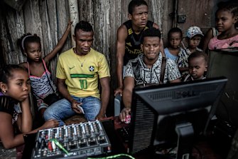 Young people at a computer during a weekly market in the Sava region of Madagascar, May 2018. Madagascar has little obvious strategic value for the Kremlin or the global balance of power. 