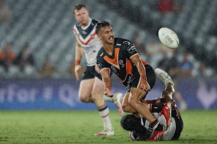 Fullback Daine Laurie slips a pass away.