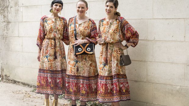 Three women who arrived at the Gorman fashion parade at Heide wearing the same dress.