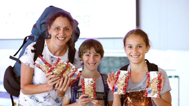 Passengers at Canberra Airport, including this family from Wagga, were delighted to find some gingerbread on the baggage carousel as a Christmas surprise this week.