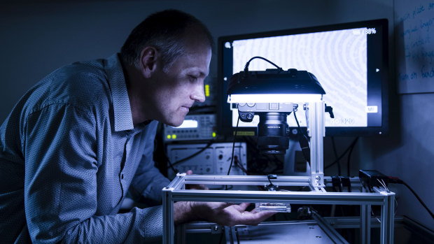 Neurophysiologist Dr Ingvars Birznieks uses high tech devices to investigate sense of touch in fingertips in his lab at Neuroscience Research Australia.