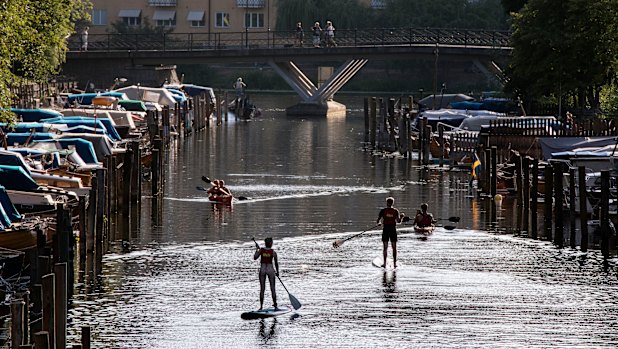 Paddle boards and canoes on Palsundet in central Stockholm last month.