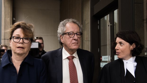 Geoffrey Rush and his wife Jane Menelaus  (left) arrive at the Federal Court on Thursday.