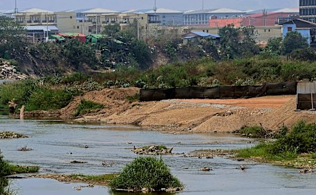 KK Park in Myanmar, known for its scam compounds, is seen across the Moei River on the Myanmar–Thailand border.