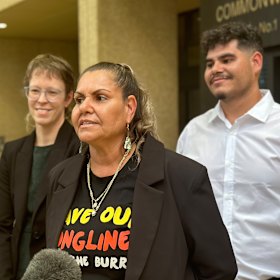 Cooper addressing the media outside court.