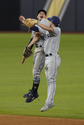 Willy Adames celebrates the win with Lowe.