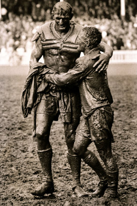 The Gladiators ... Norm Provan, left and Arthurs Summons hug in the mud after the 1963 grand final.