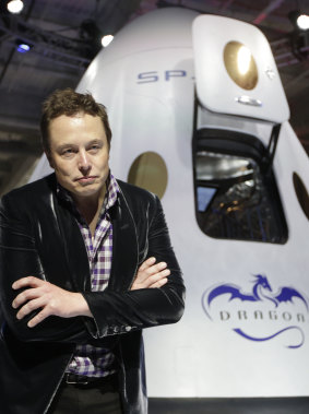 Musk in 2014 with  SpaceX Dragon V2 spacecraft.