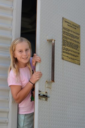 Sarah, Tim’s 11-year old daughter, peeks out of the historic observatory.